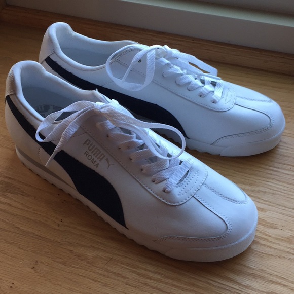 navy blue and white pumas